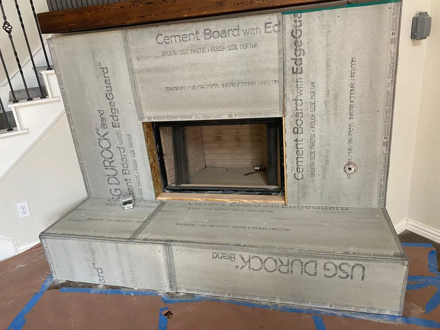 New fireplace surround and hearth covered in cement board